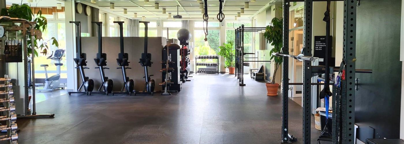 Palmers training floor with rowing machines, racks and garden light
